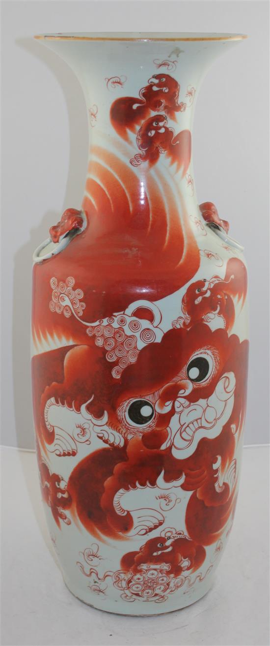 A Chinese iron red painted lion-dog baluster vase, late 19th / early 20th century, 59.5cm